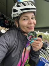 Bella Defia shows off a finishers medal after completing the 40-mile course. Photo: Facebook