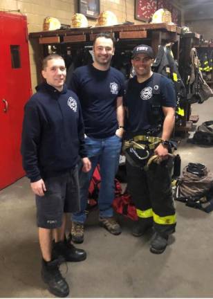 <b>Recently retired Captain Andrew Serra returned for a visit to Ladder 20 with firefighters Nick Avvento III (left) and Robert Colon (right) who served under him for nine and seven years, respectively.</b> Photo: Keith J. Kelly