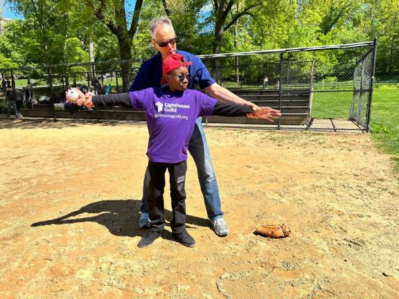 <b>Personal instruction was part of the clinic for adaptive baseball by the Lighthouse Guild’s Youth Program in Central Park. Baseballs have sleigh bells inside so players can hear where it lands.</b> Photo: Lighthouse Guild