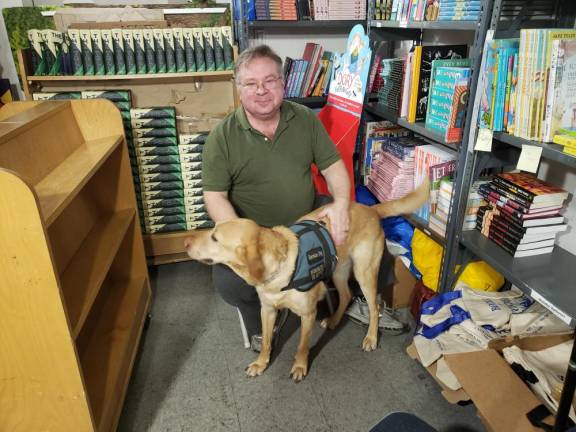 Books of Wonder founder Peter Glassman, here with his dog Deke, got his first bookstore job when he was 14.