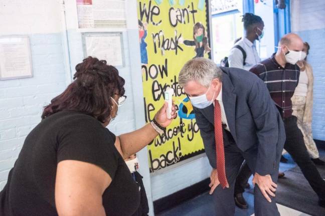Mayor Bill de Blasio getting a temperature check as students returned to school at P.S. 188 The Island School on Sept. 29, 2020. Photo: Michael Appleton/Mayoral Photography Office