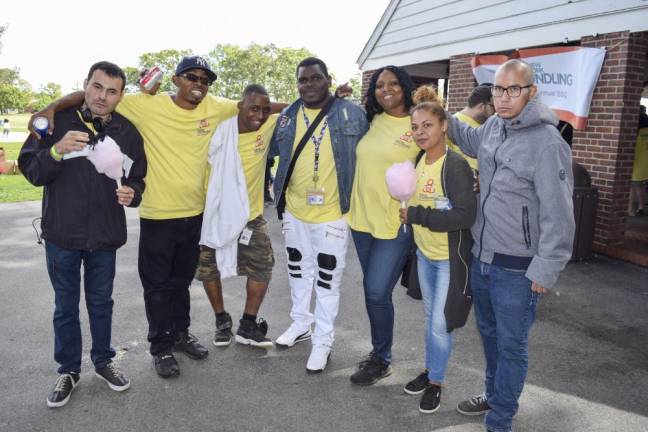 Magaretta Style (third from right) of The New York Foundling with residents and staff of the East 224th Street residence, during a BBQ in 2019.