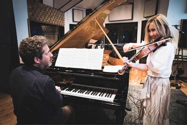 Pianist Kevin Hays and violinist/composer Meg Okura met on a cross town bus ten years ago enroute to a gig, but didn’t get around to recording a duo album until, “<i>Lingering,” </i>out on May 10th. Photo: Courtesy Meg Okura