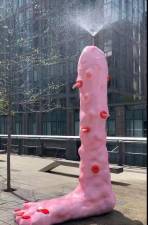 Water spouts from the top of <i>Foot Fountain (pink), </i>the latest public art on display on the High Line, sparking talk and some controversy over what some feel is a phallic symbol.