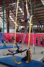 The author, top, and fellow camper Alexa Mark, perform an act called double silks in 2015.