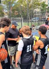 Kids gather round Coach Adrianne on the courts at the Battery Park City outlet of Asphalt Green.