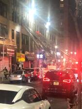<b>Fire erupted on the third floor of an unoccupied commercial building one block north of MSG on W. 35th St. on April 14th</b>. Photo: Keith J. Kelly