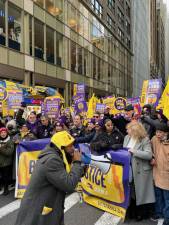 Members of 32BJ SEIU get hyped up at the intersection of Broadway and 41st. St. The union has authorized a strike, which will go down if contract negotiations with building owners remain stalled.
