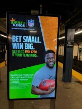 An ad for app DraftKings in the 14th Street subway station. Photo: Kay Bontempo