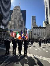 Precisely at 1 p.m., all 120,000 marchers and bands and hundreds of thousands of spectators turned south to where the Twin Towers once stood to observe a moment of silence for the 2,700 who died on 9/11, 2001.