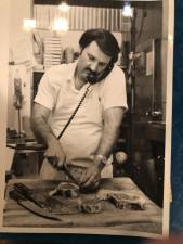 Stanley Lobel working in the butcher shop c. 1976. Photo: Roseanna Stockbridge.