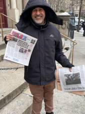 Sadik Topia holds a copy of the West Side Spirit which highlighted his plight on a front page story last week. Photo: Michael Oreskes