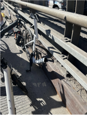 Image of the broken bike and electric scooter following the collision.