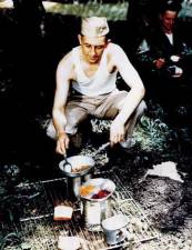 A GI preparing a meal that likely included SPAM during training in WWII.