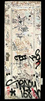 Door with graffiti tags from the studio of Jack Stewart, ca. 1970's. Metal, paint. New-York Historical Society, Gift of Regina Serniak Stewart, 2011