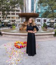 Kristina Libby with a floral heart in Bryant Park. Photo: Noel Calingasan