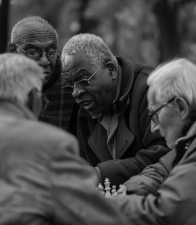 A group of friends enjoying a chess match. A new city survey has found that many older New Yorkers are reporting issues with finding adequate socialization opportunities.