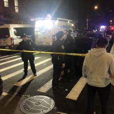 Police shut down an entire city block on East 4th Street between Avenue C and Avenue D on March 23 after a police cruiser was shot at, shattering its windshield. Cops said a suspect was taken into custody and charged but it was not clear if he was the shooter. <b>Photo: Keith J. Kelly</b>