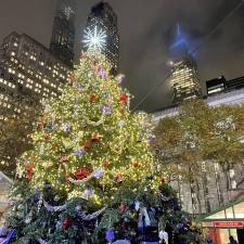 Bryant Park lit up its tree on Dec. 2, adding to holiday attractions that include a European-style outdoor market, a free ice skating rink, and a lounge for food and drinks.