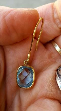 Robin Sternberg holds the twin of the missing earring in the palm of her hand. It is encased in 18-carat gold and sports what she believes is a blue topaz gemstone. Photo: Robin Sternberg