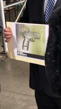<b>Police displayed a picture of the firearm they said was recovered from the suspect in the UWS shooting on Tuesday</b>. Photo: Keith J. Kelly