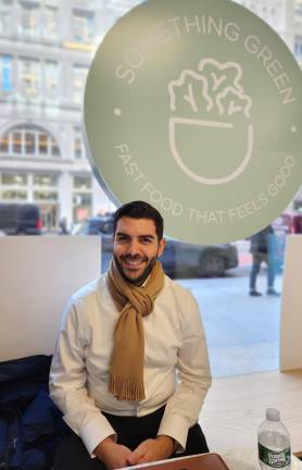 Elliot Hara in a rare relaxing moment at his new Chelsea restaurant, Something Green, in the heart of Chelsea on W. 23rd St. between Fifth and Sixth Avenues.