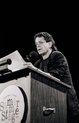 Lou Reed reads his spoken word poetry at SummerStage in 1991. Photo by Jack Vartoogian.