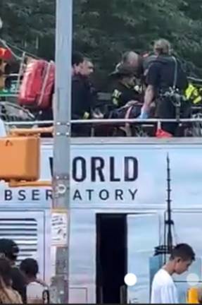 <b>EMTs tend to injured aboard a tour bus that ran a red light and collided with an MTA bus on July 6th. 32 people were injured in the collision but the FDNY said none of the injuries were life threatening</b>. Photo: Citizen app