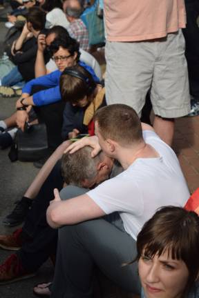 A solemn commemoration on Monday evening near the Stonewall Inn in Chelsea for the lives lost in the mass shooting in Orlando. Photo: Isodro Camacho