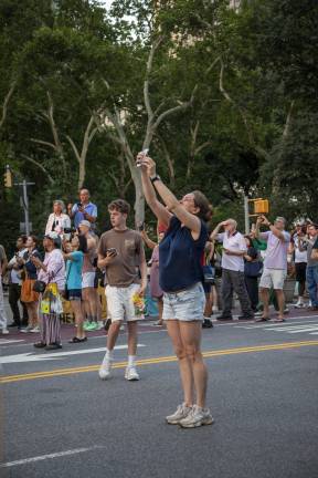 Reaching for the sky to snap the perfect photo of Manhattanhenge on July 12.