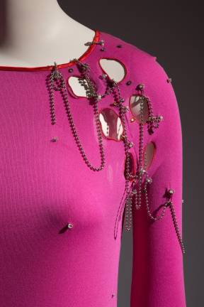 English designer Zandra Rhodes created a punk-pink outifit with chains, holes and rhinestone studs.Zandra Rhodes, ensemble, 1978, England, museum purchase. Photo: © The Museum at FIT