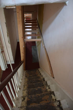 Inside the home, staircases are straining and pulling out of the wall and the curved floors indicate the building is tilting. Ceilings, too, are separating from the rest of the structure. Photo: Jeffrey Kopp