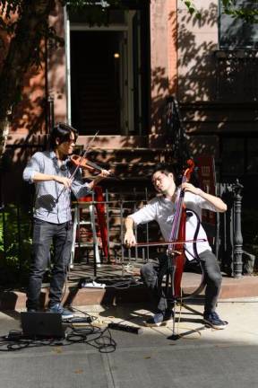 Arkai Music (Jonathan Miron on violin, Philip Sheegog on cello) played for the crowd. Photo: David Axelbank