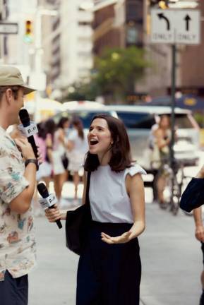 “Trackstar*” co-host Jack Coyne questions a random contestant on music trivia from the shows live base in Astor Place. Photo: Courtesy Public Opinion, Inc.