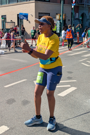 Cheering on the runners after her race at the Percy Sutton 5K.