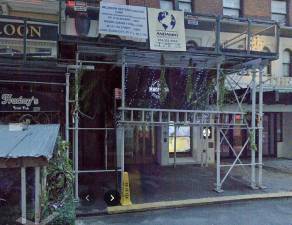 La Mararena Restaurant &amp; Sports Bar under scaffolding, Sep. 2024. The bar owners stiffed workers to the tune of over $280,000 in wages over nearly three and a half years, prosecutors charged.