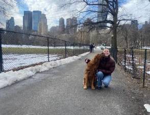 Olivia Bannerman, aka “the Poop Fairy” with the “light of her life,” her golden retriever Violet.