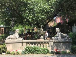 The Sphinx statues near the entrance of the popular Elizabeth Street Garden in Little Italy.