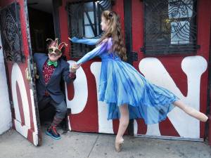 At a weekly meeting of the planning committee of Theater for the New City's Lower East Side Festival of the Arts, performers Miguel Loyola and Toni Renee Taylor, romped at theater's entrance after raiding its costume collection. They will both be performing at this year’s festival which runs from May 23 to 25.