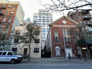 The former site of the St. Benedict the Moor Church, 338-342 W. 53rd St., has a 1965 rectory and an 1869 church. The rectory will be replaced by a seven-story apartment building, while the church will be renovated.