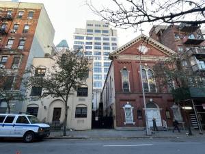 The former site of the St. Benedict the Moor Church, 338-342 W. 53rd St., has a 1965 rectory and an 1869 church. The rectory will be replaced by a seven-story apartment building, while the church will be renovated.