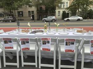 Empty Shabbat table installation outside of the American Museum of Natural History on Oct. 27.