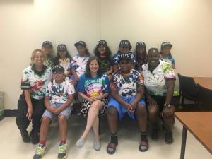 The 20th precinct day camp kids, in the tie-dye shirts they made. With them, in the front row, are Officer Nefta Richards (far right), Sergeant Rosa Espinal (far left) and Council Member Helen Rosenthal (center).