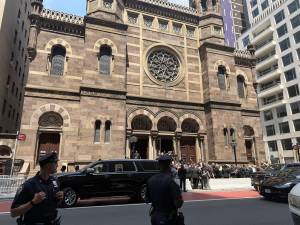 Attendees converse outside the Synagogue after Davis’ funeral.
