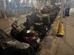 Congregation of e-bikes parked outside the Redbury hotel migrant shelter has been an ongoing source of complaints from residents at the Midtown South Community Council meetings.
