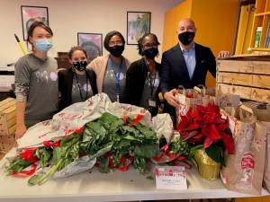 Alan van Capelle (right) with EA staff and volunteers. Photo courtesy of Educational Alliance