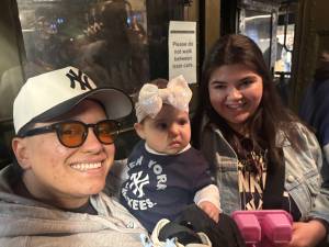 A mom named Michelle (right) accompanied by her daughter Lulu and her husband were among the fans who climbed on board the Yankee Express nostalgia train. “It’s amazing,” she said of the special train.