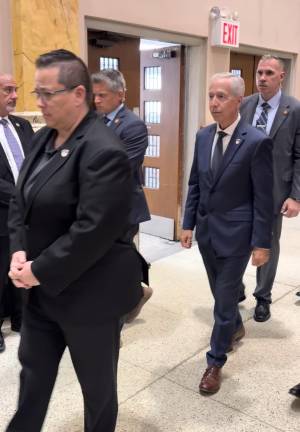 FDNY Commissioner Lilian Bonsignore (left), with retired FDNY First Deputy Commissioner Joseph Pfeifer— Battalion 1 Chief on 9/11— walking behind her.