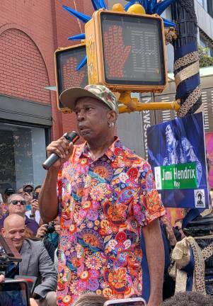 Hundreds experience Jimi Hendrix Way unveiling, including Vernon Reid in a camouflage Knicks hat.