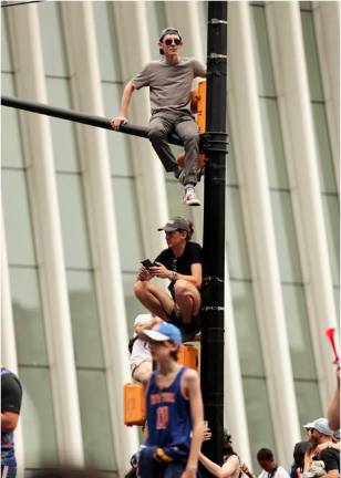 Fans climbed traffic lights along the Canyon of Heroes